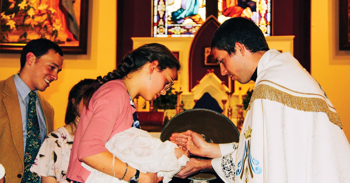 Fr. Nicholas baptizing his niece, Frances.