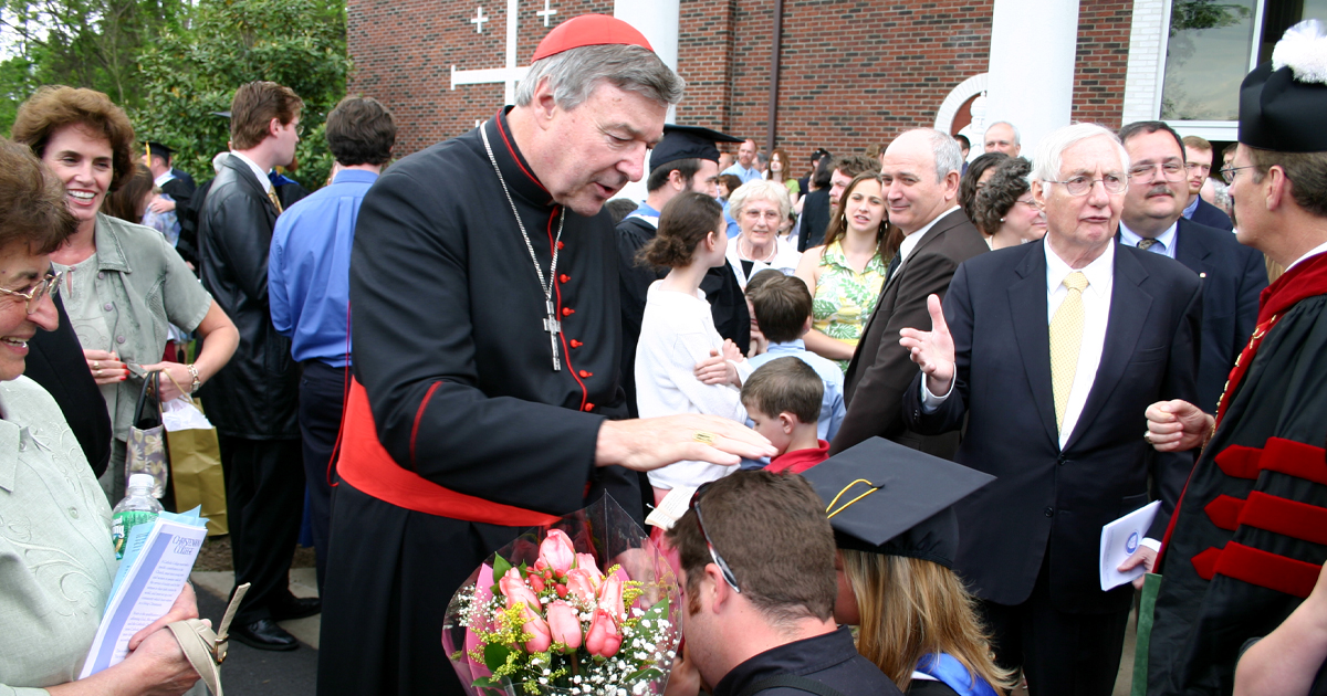 Cardinal Pell blessing students following the 2006 Commencement Ceremonies.