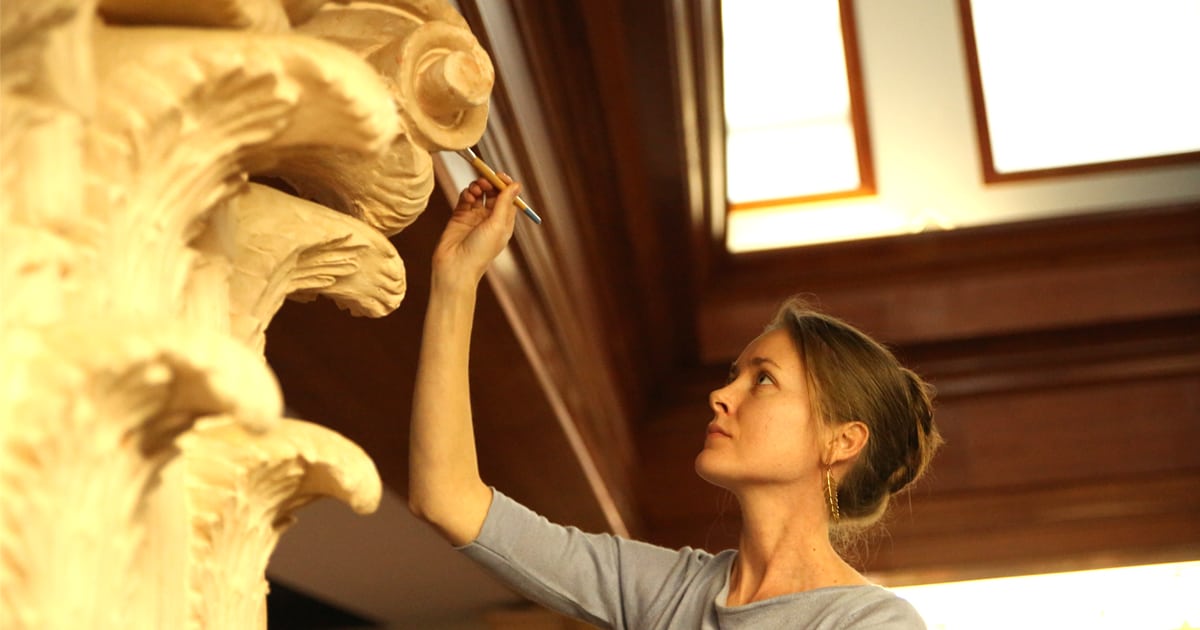 Mandy painted the columns of Christendom's St. John the Evangelist Library.
