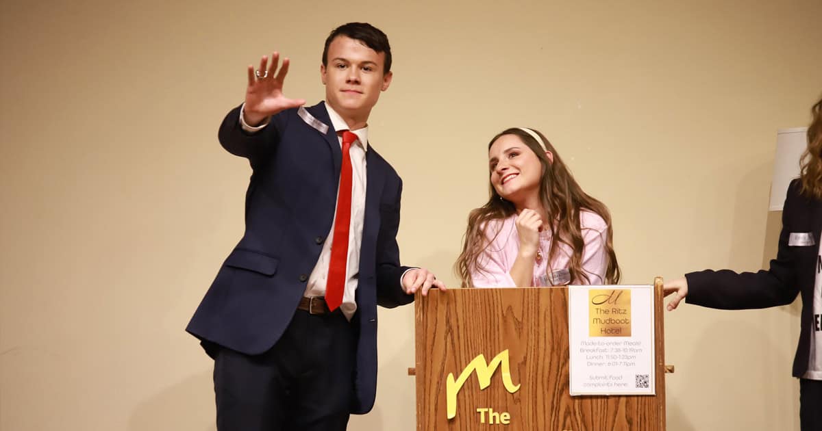 Students John Paul Driver (left) and Mary Fowler (right) perform a scene from this year's Mystery Dinner Theater.