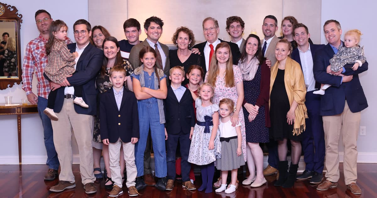 The O’Donnells stand with eight of their nine children (with spouses) and nine of their 20 grandchildren at a celebration honoring his 30 years as president.