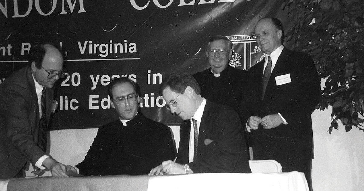 Fr. William Saunders and O’Donnell sign Notre Dame Institute merger, creating the college’s graduate school.