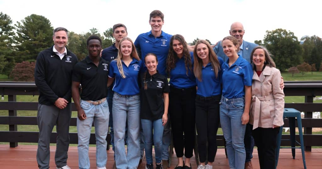 Thomas S. Vander Woude Scholarship Recipients Lucy Stahl Edmund Thomas, Regina Bonvissuto, Miranda Keller, Megan Lovar, Bobby Vander Woude, Mary Pennefather, Charlie Ackla, and Daniel Schultz with Athletic Director Patrick Quest, College President George A. Harne, Ph.D., and his wife, Debbie.