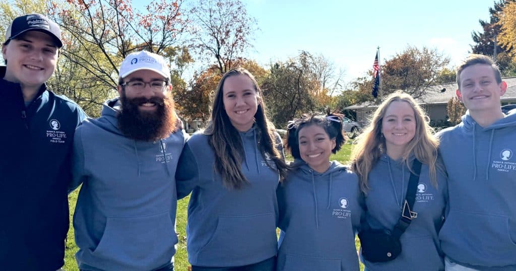 Clark (center) with fellow Christendom student Cody Tucker (second from left), along with other students volunteering for SBA. 