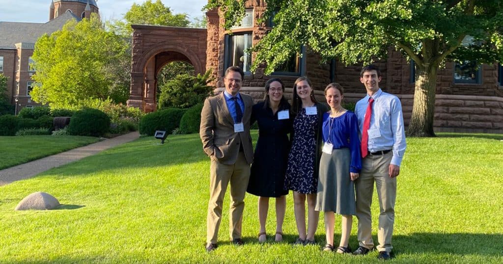Jane Maschue (second from left) with four other fellow alumni at a conference at St. Louis University. All five were students of Dr. Brendan McGuire, Maschue's biggest mentor, and were thrilled to be together again at the university where he completed his studies.