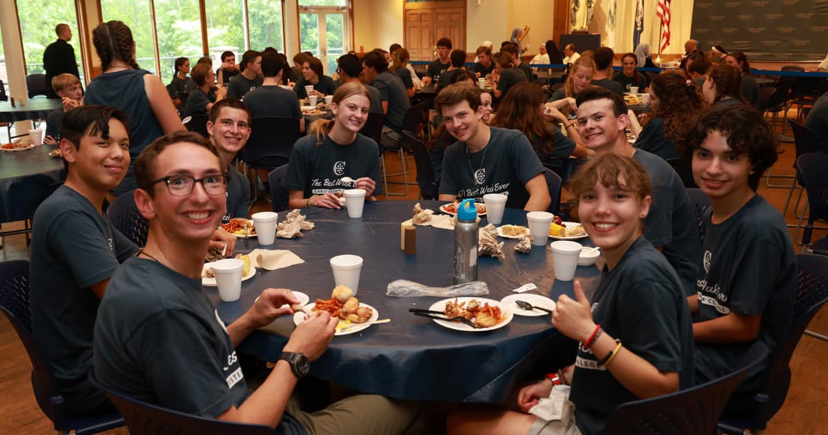 Hollis and Trujillo both sharing a meal together during Christendom Best Week Ever high school summer program last year. 