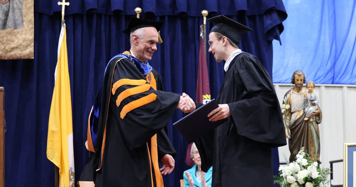 College President George A. Harne, Ph.D., with his son, Elliot, who graduated during the college's 2026 Commencement Ceremonies. 